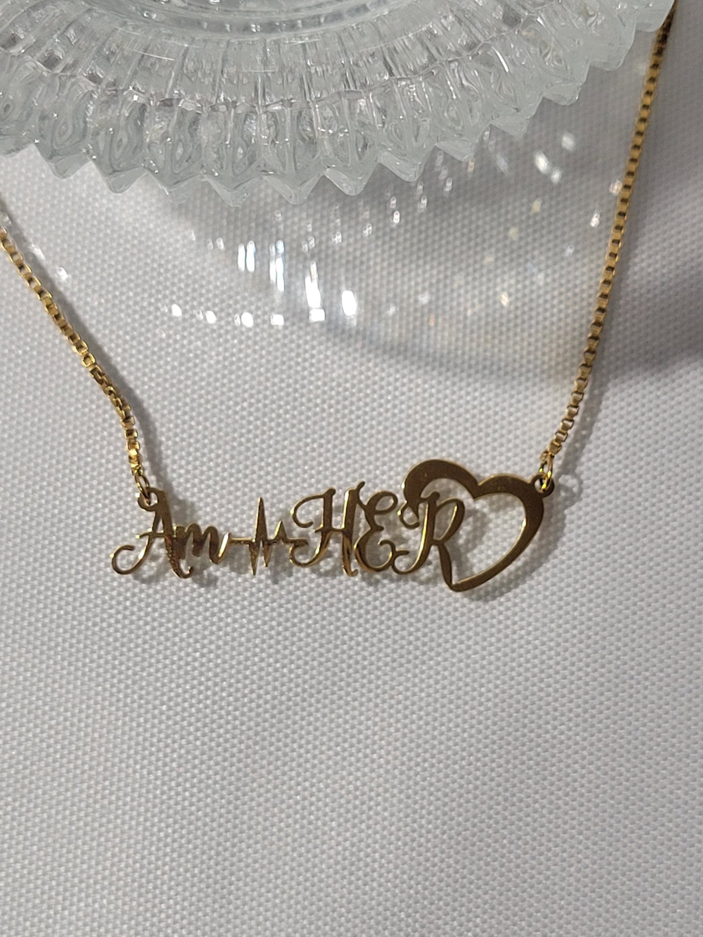 AM HER NECKLACE