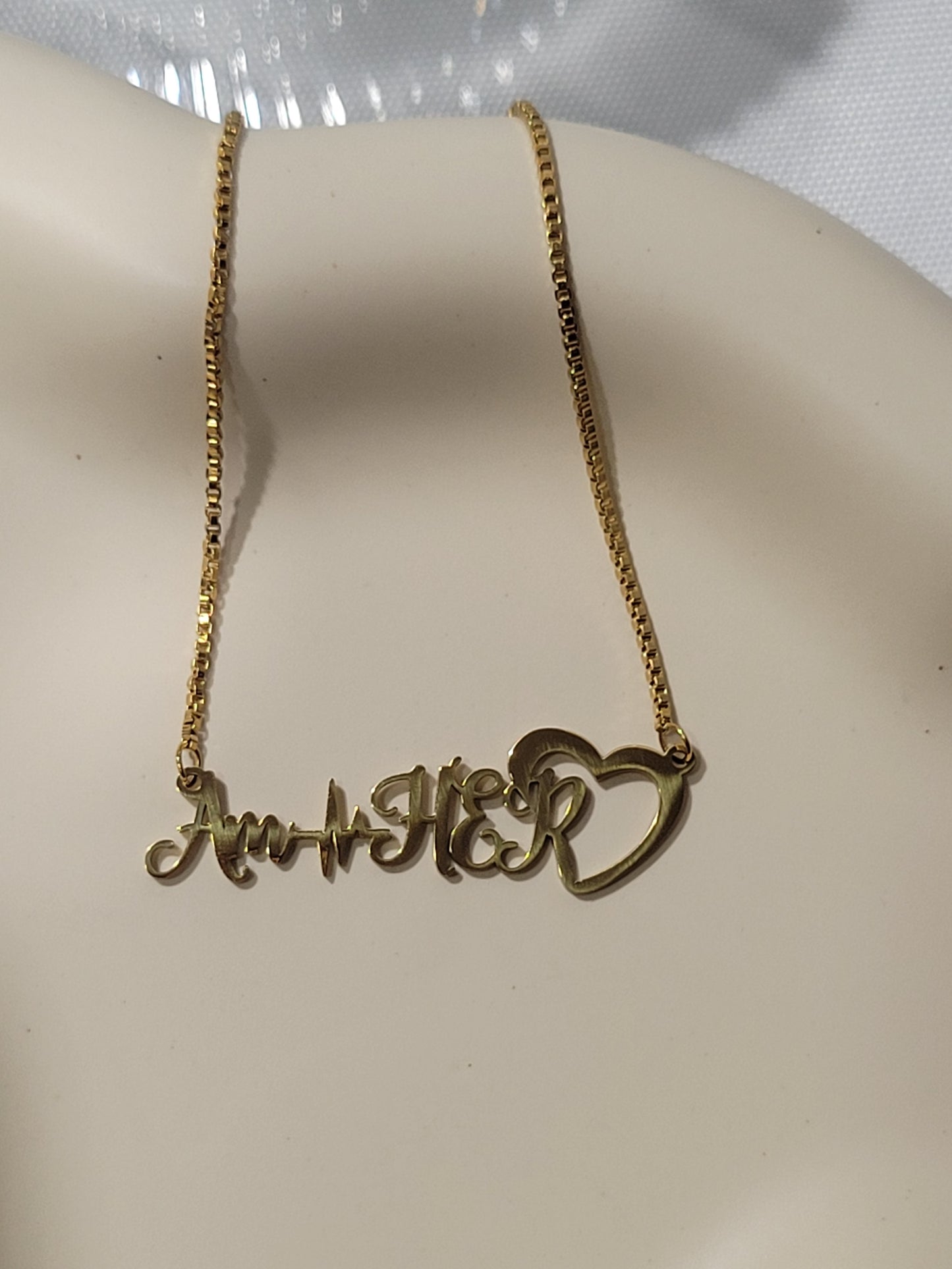 AM HER NECKLACE