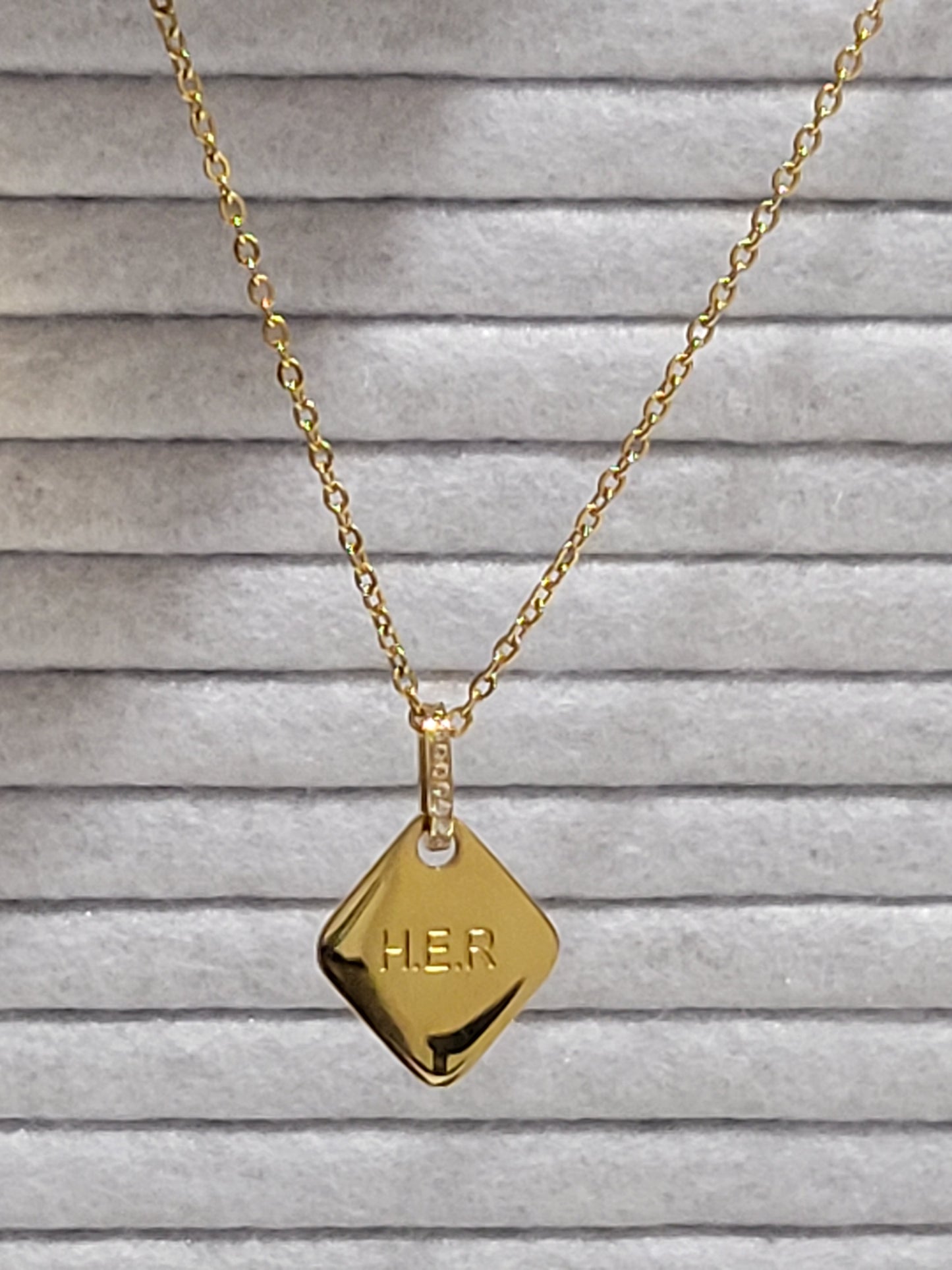 HER NECKLACE