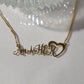 AM HER NECKLACE